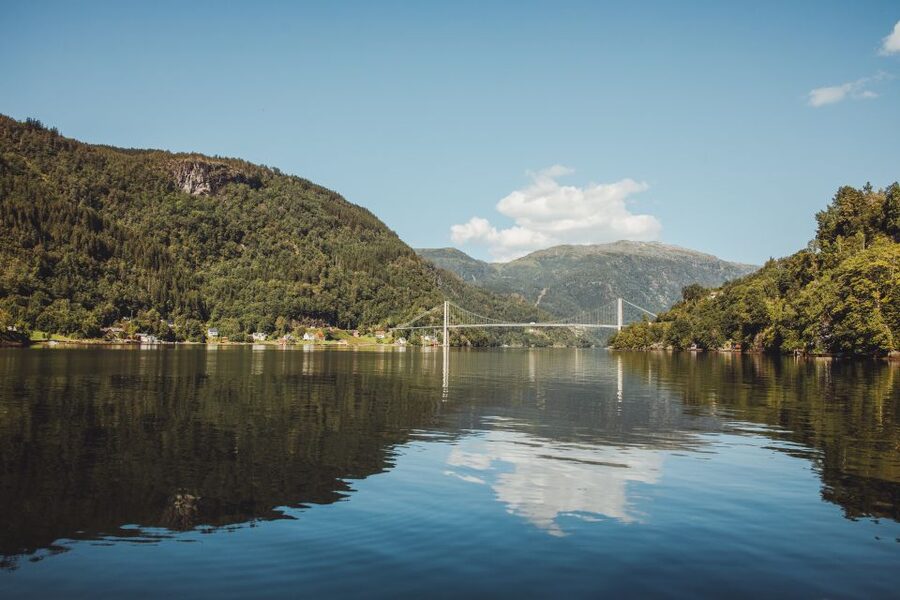 Øystese: Hardangerfjord and Fyksesund RIB Fjord Adventure - Passing under the bridge and stopping at quiet coves