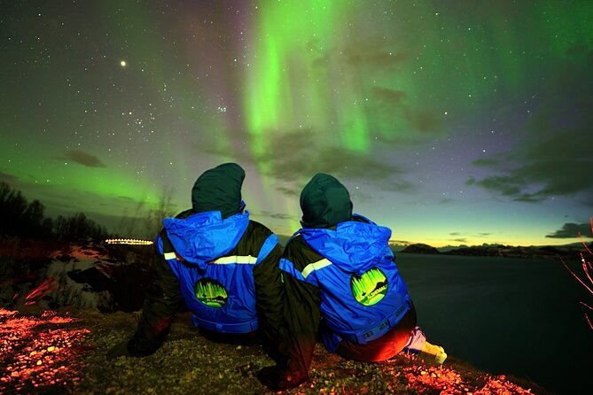 Tromsø Fjordland Aurora Chase Northern Lights by the Arctic Sea - Thermal suits and the campfire make the waiting easier